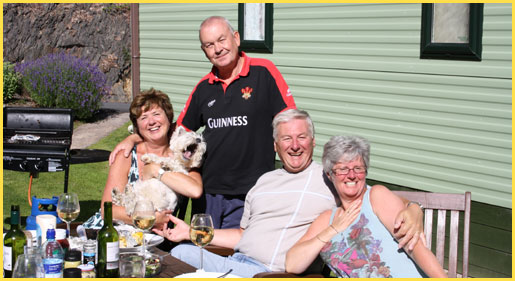 Trevor, Denise, Judy and Graham enjoy a Barbecue at Clywedog Riverside Holiday Home Park in Mid Wales